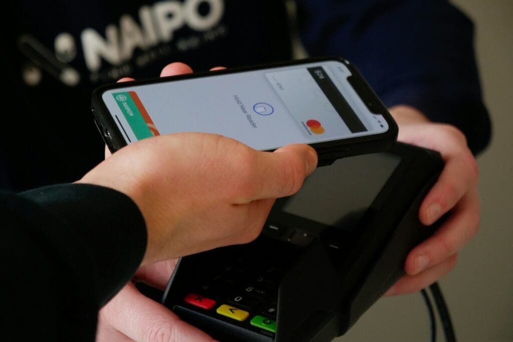 black android smartphone with a digital wallet holding showing emoney